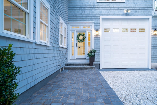 view of exterior entry featuring a garage