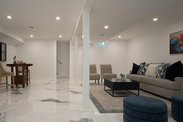 living area with marble finish floor, visible vents, and recessed lighting