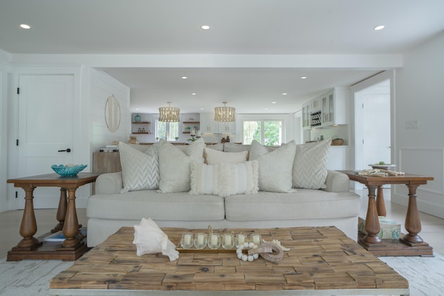 living area featuring wood finished floors and recessed lighting