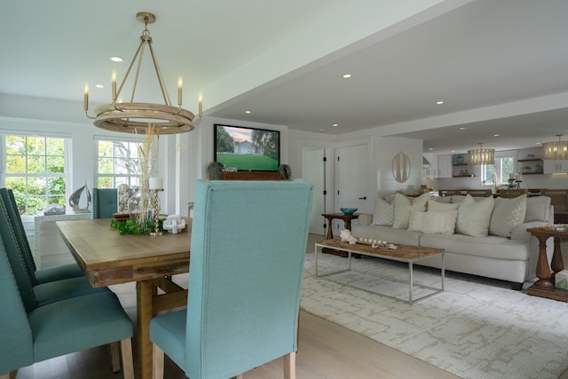 dining room featuring a chandelier, wood finished floors, and recessed lighting