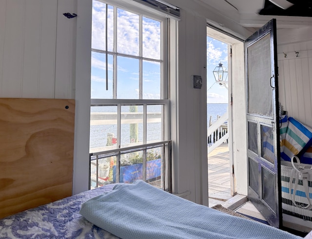 bedroom featuring a water view