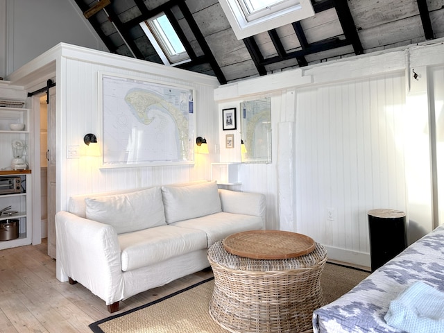 living room featuring hardwood / wood-style flooring, high vaulted ceiling, and wood walls