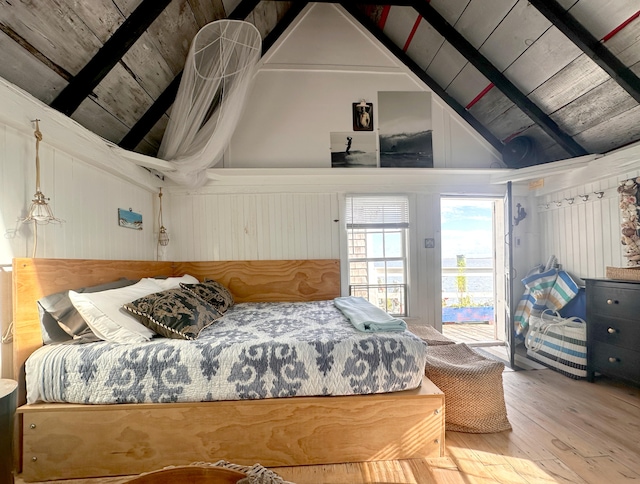 bedroom with wood ceiling, vaulted ceiling with beams, access to outside, and wood-type flooring