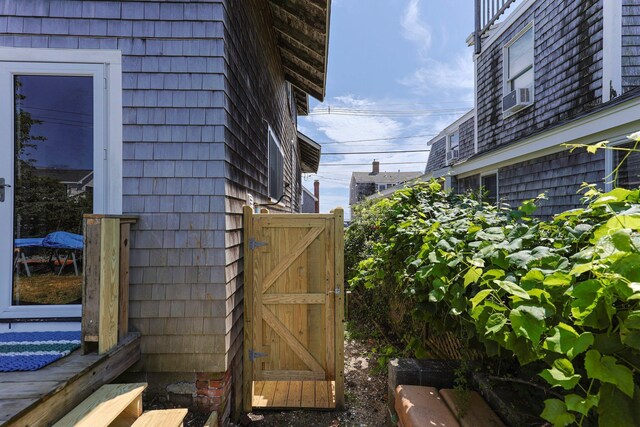 view of side of property with cooling unit