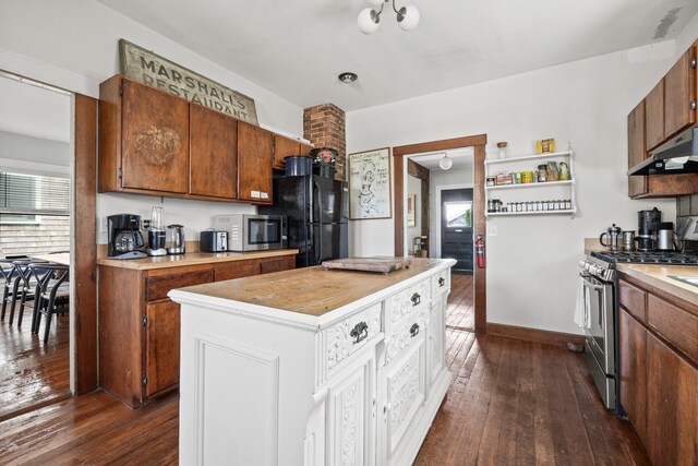 kitchen with dark hardwood / wood-style flooring, a healthy amount of sunlight, and stainless steel appliances