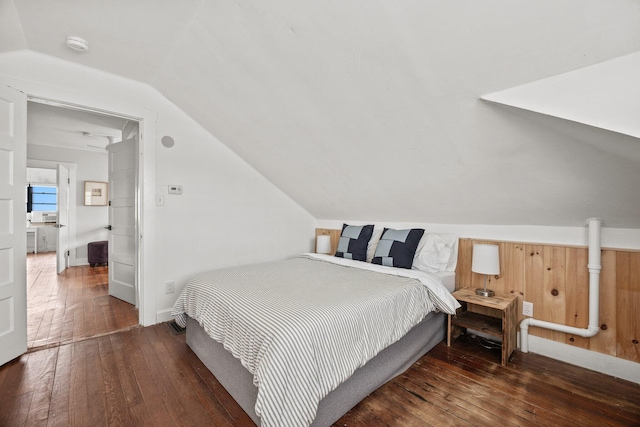 bedroom with dark hardwood / wood-style floors and vaulted ceiling