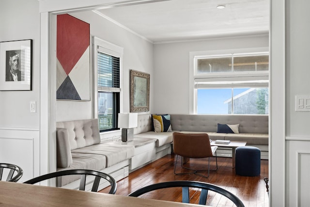 living room with crown molding and dark hardwood / wood-style flooring