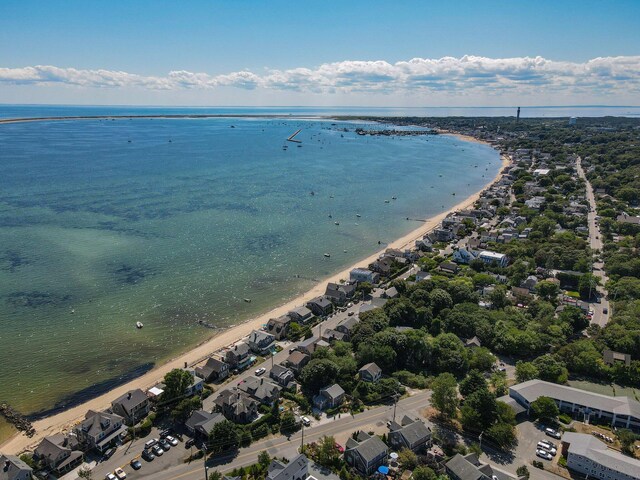 birds eye view of property with a water view and a view of the beach