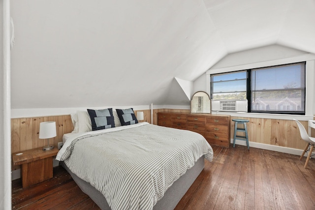 bedroom featuring cooling unit, vaulted ceiling, and dark hardwood / wood-style flooring