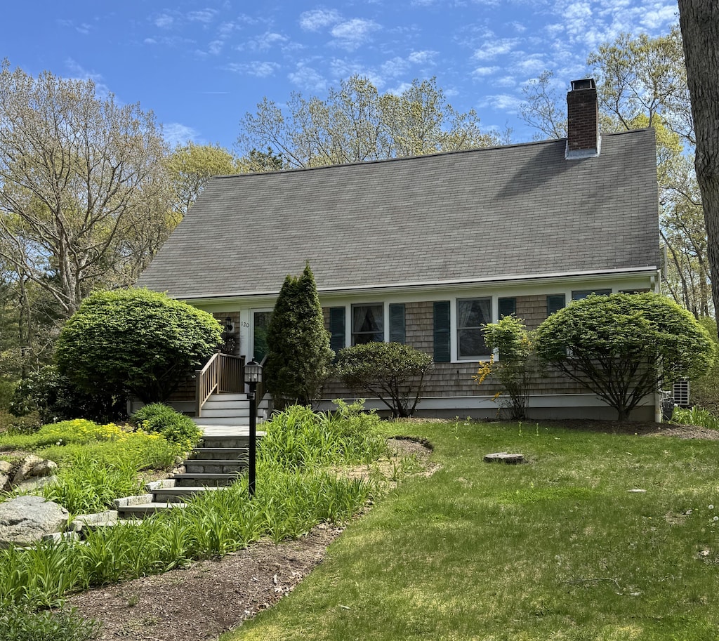 120 Berkshire Trl, West Barnstable, MA 02668 - cape cod house with a chimney, roof with shingles, a front lawn, and stairs