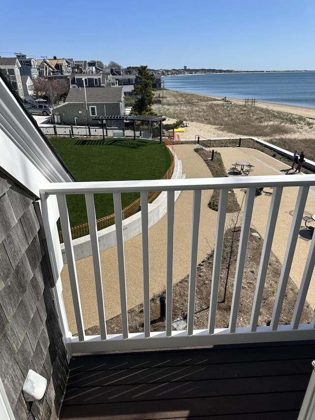 balcony featuring a water view