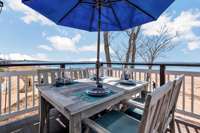 wooden deck featuring outdoor dining area