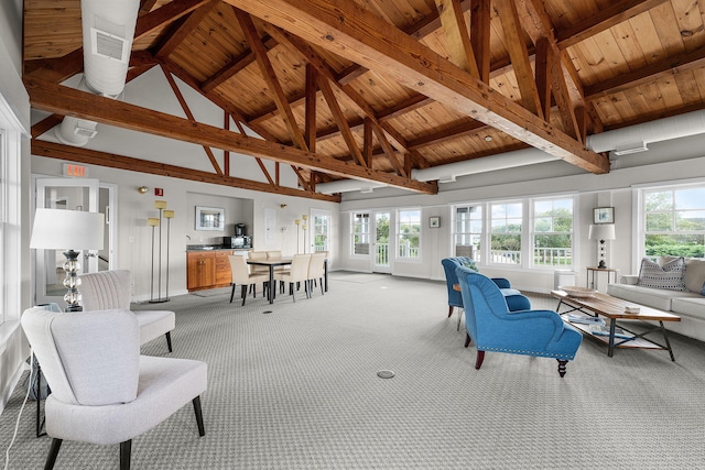 living room featuring beamed ceiling, plenty of natural light, light carpet, and wooden ceiling