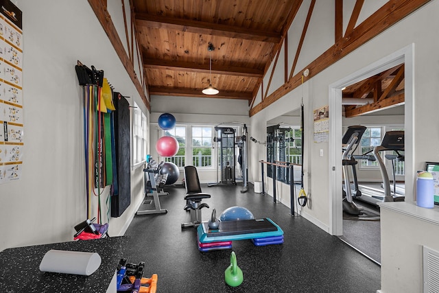 gym featuring vaulted ceiling and wooden ceiling