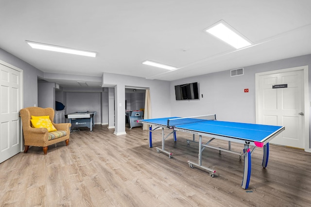 recreation room featuring light hardwood / wood-style flooring