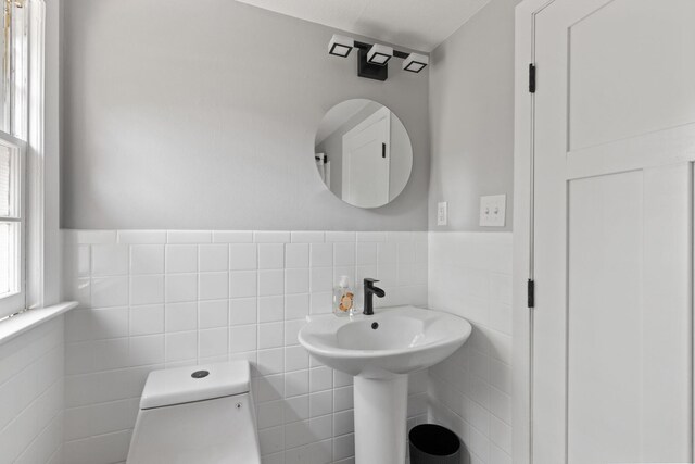6 Januit St, Sandwich, MA 02563 - bathroom featuring tile walls, toilet, and a wainscoted wall