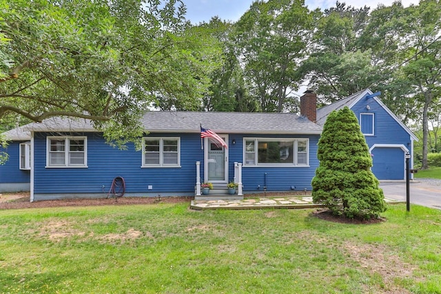 6 Januit St, Sandwich, MA 02563 - view of front of property with a front lawn, a garage, a chimney, and driveway