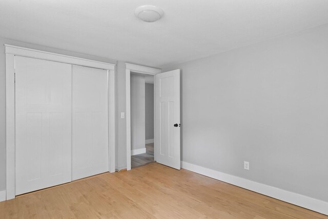 6 Januit St, Sandwich, MA 02563 - unfurnished bedroom with light wood finished floors, baseboards, and a closet