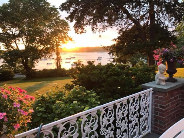 balcony at dusk with a water view