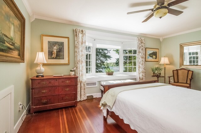 bedroom featuring ceiling fan, crown molding, and dark hardwood / wood-style flooring