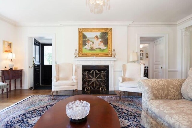 living room with dark hardwood / wood-style flooring and ornamental molding