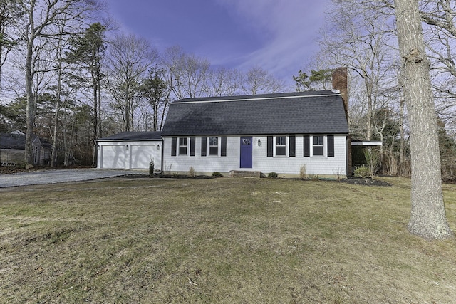 ranch-style home with a garage and a yard