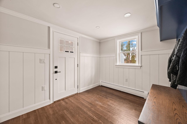 foyer featuring a baseboard radiator, dark hardwood / wood-style flooring, and ornamental molding