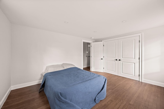 bedroom featuring dark wood-type flooring