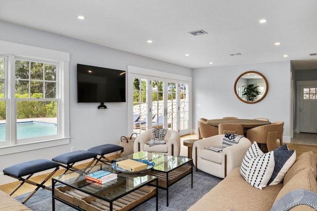 living room featuring dark hardwood / wood-style flooring and french doors