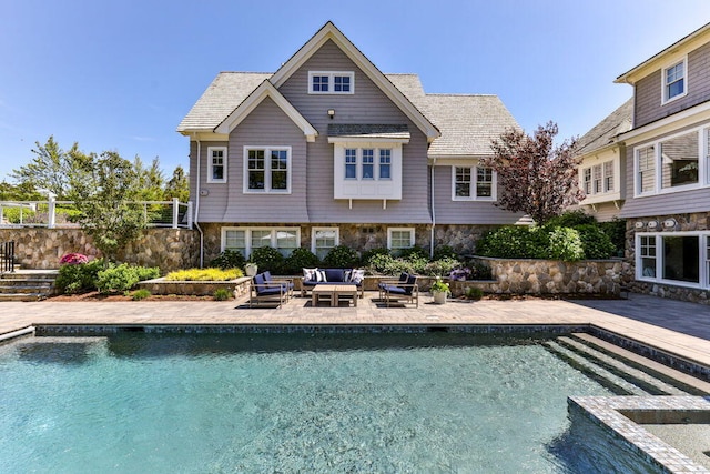 view of swimming pool featuring outdoor lounge area and a patio