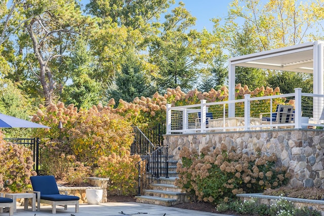 view of patio / terrace featuring stairway