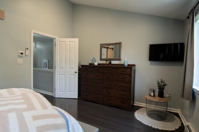 bedroom featuring baseboards, baseboard heating, lofted ceiling, and dark wood-style flooring