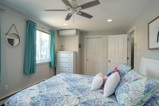 bedroom featuring a baseboard radiator, recessed lighting, ceiling fan, a closet, and a wall mounted air conditioner