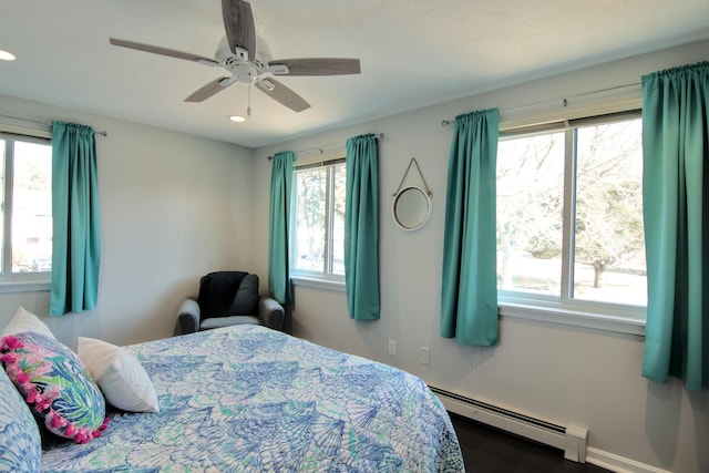 bedroom with recessed lighting, a baseboard heating unit, and ceiling fan