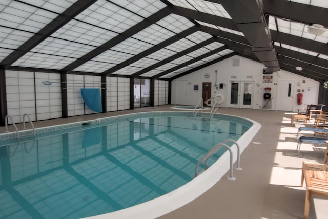 community pool featuring a patio, an indoor hot tub, and a lanai