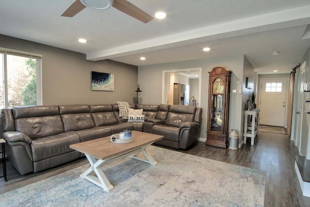 living room with recessed lighting, beamed ceiling, a healthy amount of sunlight, and wood finished floors