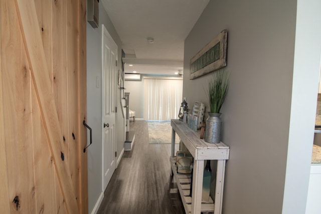 hall with baseboards and dark wood-style flooring