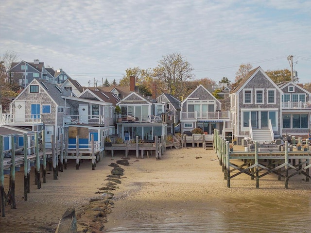 back of property with a water view