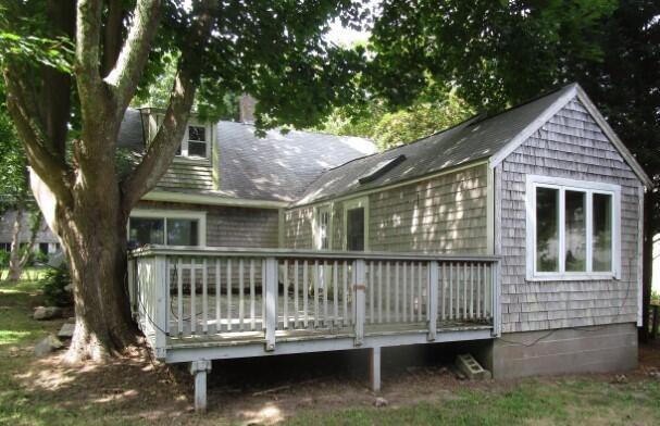 rear view of house with a wooden deck