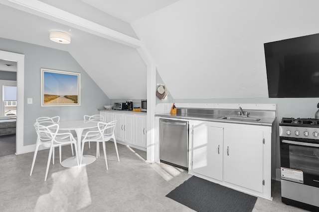 kitchen with white cabinetry, appliances with stainless steel finishes, sink, and stainless steel counters