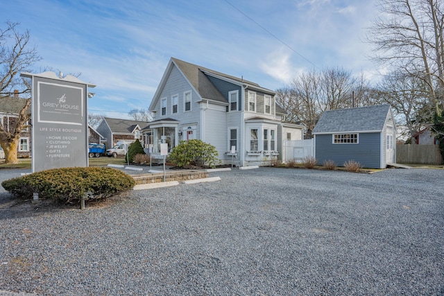 view of home's exterior featuring a storage unit