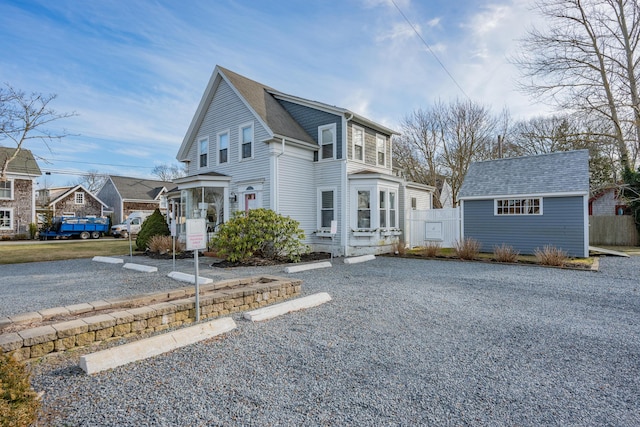 view of front of property with an outdoor structure