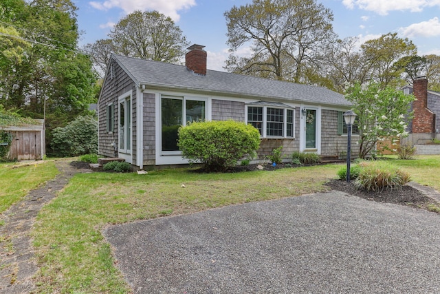 61 Uncle Bills Way S, Dennis, MA 02660 - view of front of property with a chimney and a shingled roof