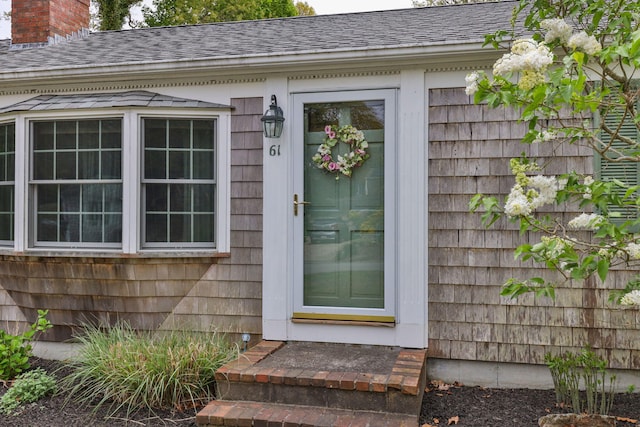 61 Uncle Bills Way S, Dennis, MA 02660 - entrance to property featuring a chimney and roof with shingles