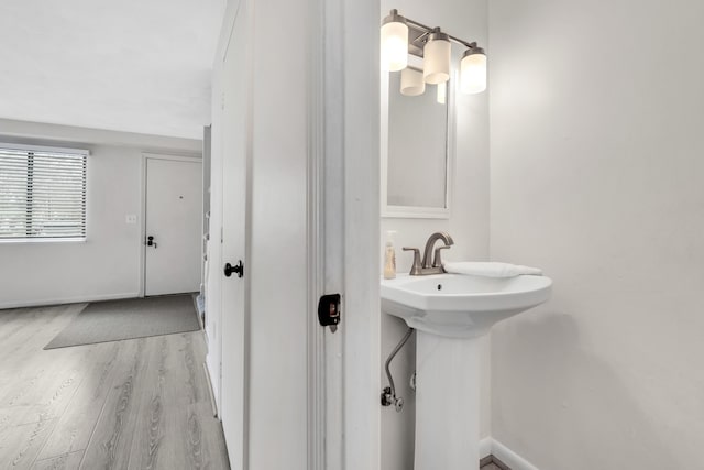 bathroom featuring baseboards and wood finished floors