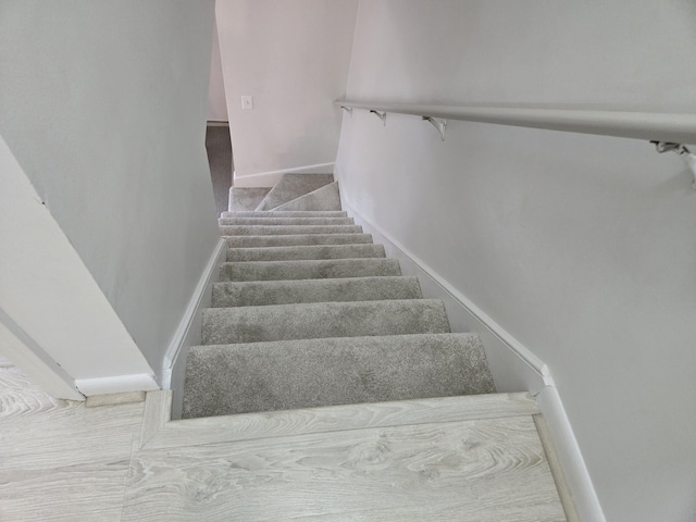 stairs with carpet flooring