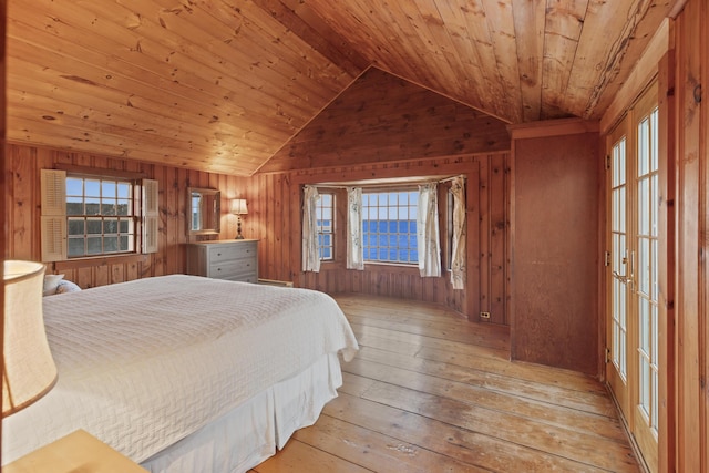 bedroom with wooden ceiling, multiple windows, vaulted ceiling, and light hardwood / wood-style floors