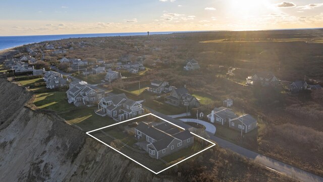 aerial view at dusk with a water view