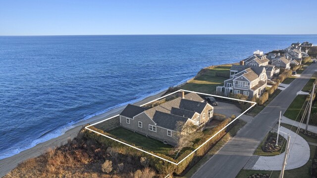 drone / aerial view with a water view and a view of the beach