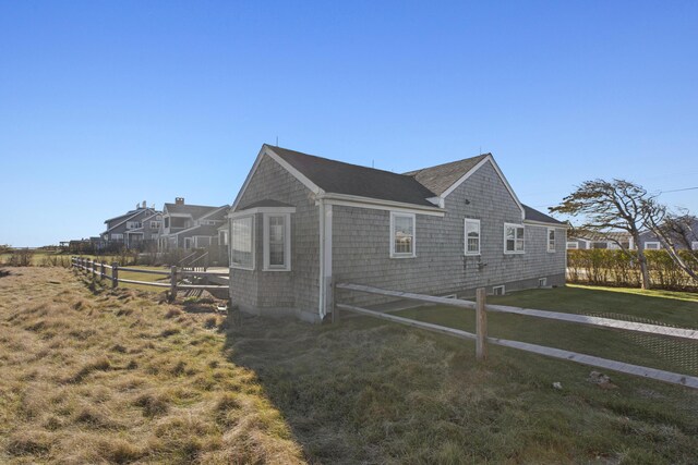 view of home's exterior with a yard